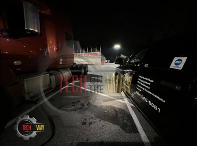 Tech On The Way — Tech On The Way branded service truck on a night-time service call at a customer location